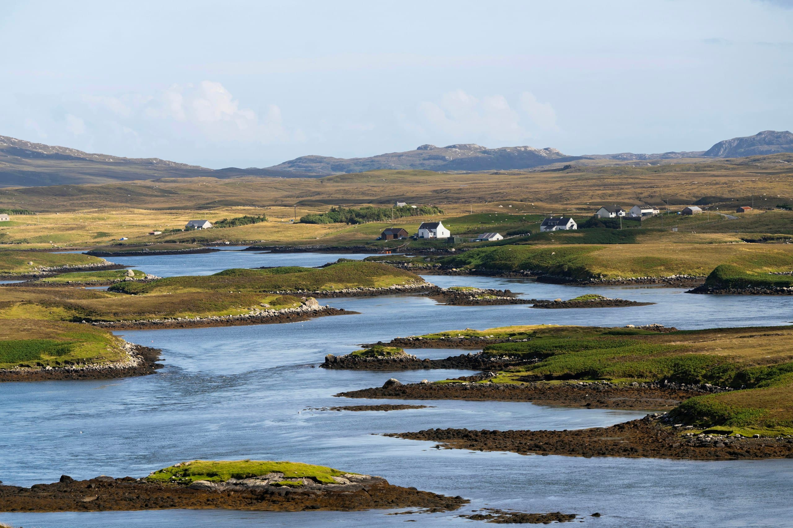 Lochans and scattered croft houses across Hebridean moorland